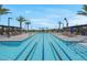 Resort-style swimming pool with lane markers, and lounge chairs for relaxing by the pool at 9608 Bloodstone Ln, Las Vegas, NV 89143