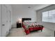 Bedroom with a window, soft carpet and a bed with a colorful quilt at 965 Nevada State Dr # 24201, Henderson, NV 89002