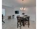 Bright dining area featuring an elegant chandelier and space for entertaining at 965 Nevada State Dr # 24201, Henderson, NV 89002