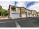 Modern townhome with a two-car garage and neutral color palette at 965 Nevada State Dr # 24201, Henderson, NV 89002