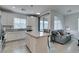 Open-concept kitchen flowing into a cozy living area with a comfortable sofa at 965 Nevada State Dr # 24201, Henderson, NV 89002