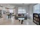 Cozy living room with a neutral-toned sofa and open view to the modern kitchen at 965 Nevada State Dr # 24201, Henderson, NV 89002