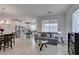 Open-concept living room with tile floors and natural light at 965 Nevada State Dr # 24201, Henderson, NV 89002