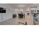 A bright and inviting living space with a dining area and modern kitchen in the background at 965 Nevada State Dr # 24201, Henderson, NV 89002