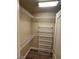 Walk-in closet with custom shelving for maximum storage and organization at 9758 Panther Hollow St, Las Vegas, NV 89141