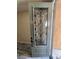 Gray front door with decorative glass insert at 9758 Panther Hollow St, Las Vegas, NV 89141