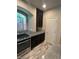 Updated kitchen with granite counters, stainless steel appliances, and stylish cabinetry at 9758 Panther Hollow St, Las Vegas, NV 89141