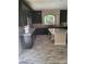 Gourmet kitchen with granite countertops, stainless appliances, and island at 9758 Panther Hollow St, Las Vegas, NV 89141