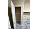 Interior laundry area visible from doorway, includes utility connections and an open door for added convenience at 9758 Panther Hollow St, Las Vegas, NV 89141