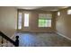 Light-filled living room showcasing windows, decorative front door and stylish flooring at 9758 Panther Hollow St, Las Vegas, NV 89141