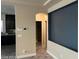 Open-concept living area boasts wood-look floors, neutral walls, and modern features, providing a cozy space at 9758 Panther Hollow St, Las Vegas, NV 89141