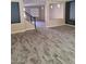 Inviting living room featuring hardwood floors and a staircase to the upper level at 9758 Panther Hollow St, Las Vegas, NV 89141