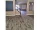 Inviting living room featuring hardwood floors and a staircase to the upper level at 9758 Panther Hollow St, Las Vegas, NV 89141