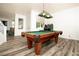 Basement game room with a classic billiards table, perfect for Gathering fun and entertaining at 1017 Fairbury St, Henderson, NV 89052