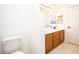Bathroom features a double sink vanity with wood cabinets and a separate toilet area at 1017 Fairbury St, Henderson, NV 89052