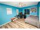 Bedroom featuring fan, luxury vinyl plank floors, desk and closet at 1017 Fairbury St, Henderson, NV 89052