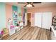 Spacious bedroom featuring luxury vinyl plank floors and white closet at 1017 Fairbury St, Henderson, NV 89052