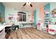 Bright craft room featuring wood floors, creative storage solutions, and ample natural light at 1017 Fairbury St, Henderson, NV 89052