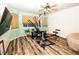 Bright exercise room features wood floors, modern equipment, and natural light from a window at 1017 Fairbury St, Henderson, NV 89052