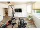 Exercise room featuring workout equipment, a ceiling fan, and natural light from a window at 1017 Fairbury St, Henderson, NV 89052