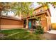 Close-up of a home's entrance featuring desert landscaping and a vibrant blue front door at 1017 Fairbury St, Henderson, NV 89052