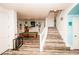 Finished basement with wood laminate floors, a billiards table, and a stairway to the upper level at 1017 Fairbury St, Henderson, NV 89052