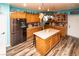 Updated kitchen featuring an island, breakfast bar, and stainless steel appliances at 1017 Fairbury St, Henderson, NV 89052
