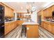 Well-equipped kitchen features a large island, stainless steel appliances, and lots of cabinet storage at 1017 Fairbury St, Henderson, NV 89052