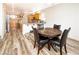 Open-concept kitchen features an adjacent dining area with a round table and seating for four at 1017 Fairbury St, Henderson, NV 89052