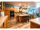 Modern kitchen with an island, breakfast bar, and stainless steel appliances at 1017 Fairbury St, Henderson, NV 89052