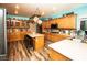 Well-appointed kitchen featuring an island with seating and stainless steel appliances at 1017 Fairbury St, Henderson, NV 89052