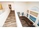 Spacious living room with a sectional sofa, tall ceilings, and natural light from multiple windows at 1017 Fairbury St, Henderson, NV 89052
