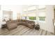 Spacious living area with wood floors and large windows offering a view of the outdoors at 1017 Fairbury St, Henderson, NV 89052