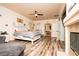 The main bedroom features wood-look floors, neutral colors, and a peek into an adjacent room at 1017 Fairbury St, Henderson, NV 89052