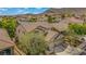 Suburban two-story home, featuring desert landscaping with a mountain in the background at 10385 Grassyrock Ct, Las Vegas, NV 89129