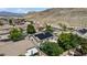 Charming neighborhood nestled against a picturesque mountain backdrop with solar panels at 10385 Grassyrock Ct, Las Vegas, NV 89129