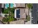 Aerial view of home's roof with solar panels, swimming pool and manicured yard at 10385 Grassyrock Ct, Las Vegas, NV 89129