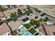 A vibrant community with green lawns, sparkling pools, and solar panels in a neighborhood at 10385 Grassyrock Ct, Las Vegas, NV 89129