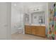 Bathroom featuring a double vanity sink, drawers, mirror, and a toilet at 10385 Grassyrock Ct, Las Vegas, NV 89129