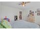 Well-lit bedroom features a ceiling fan and cute painted furniture at 10385 Grassyrock Ct, Las Vegas, NV 89129