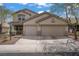 Attractive two-story house with a convenient two-car garage and a welcoming front yard at 10385 Grassyrock Ct, Las Vegas, NV 89129