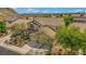 Charming two-story home with a well-manicured front yard and a three car garage at 10385 Grassyrock Ct, Las Vegas, NV 89129