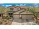 Charming two-story home featuring a two-car garage and well-maintained landscaping at 10385 Grassyrock Ct, Las Vegas, NV 89129