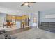 Open concept kitchen boasts wood cabinets, stainless steel appliances, and a breakfast bar at 10385 Grassyrock Ct, Las Vegas, NV 89129