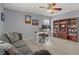This living room includes a sofa and computer desk setup, complete with custom built-in shelving at 10385 Grassyrock Ct, Las Vegas, NV 89129