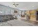 Spacious living room seamlessly connects to the kitchen and dining area with lots of natural light at 10385 Grassyrock Ct, Las Vegas, NV 89129