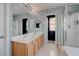 Spacious bathroom with double sinks, a large mirror, and a separate shower and tub at 1141 Cactus Rock St, Henderson, NV 89011