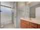 Clean bathroom with a single sink vanity, a toilet, and a shower with a curtain at 1141 Cactus Rock St, Henderson, NV 89011