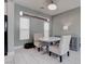Charming dining area with modern lighting, a round table, and neutral-toned chairs at 1141 Cactus Rock St, Henderson, NV 89011