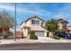 Charming two-story home with a well-maintained lawn, desert landscaping, and a two-car garage at 1141 Cactus Rock St, Henderson, NV 89011